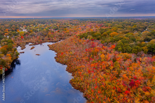 overcast aerial image of a fall lake