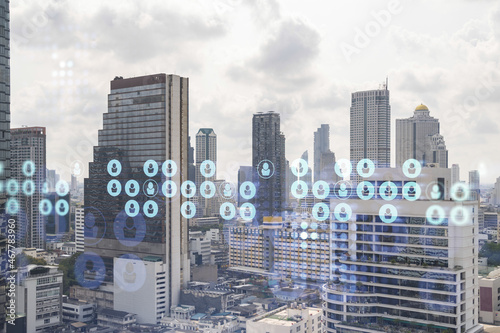 Social media icons hologram over panorama city view of Bangkok  Southeast Asia. The concept of people networking  connections and career opportunities. Double exposure.