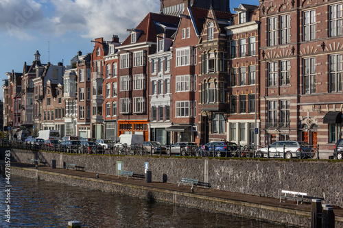 View of traditional houses along the canal in the old city of Amsterdam, Netherlands. © Arkadii Shandarov