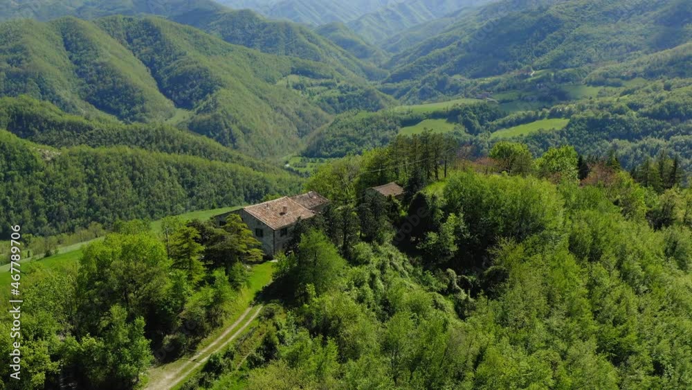 Aerial Beautiful View Of Houses On Green Hilltop, Drone Flying Over Trees - Apennine Mountains, Italy Aerial Beautiful View Of Houses On Green Hilltop, Drone Flying Over Trees - Apennine Mountains, Italy