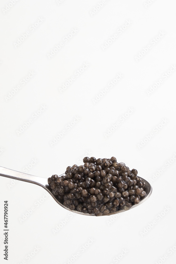 Black caviar close up isolated white background Black caviar close up isolated white background