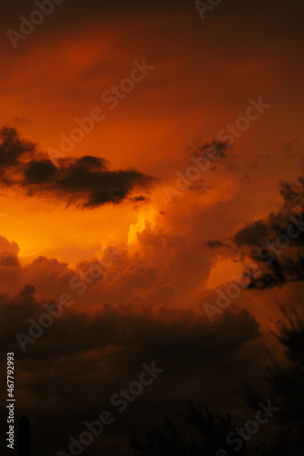 Moody orange sky during desert storm monsoon season in Arizona
