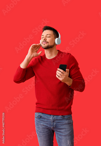 Man with phone and headphon...