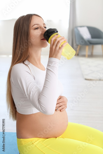 Young pregnant woman in sty...
