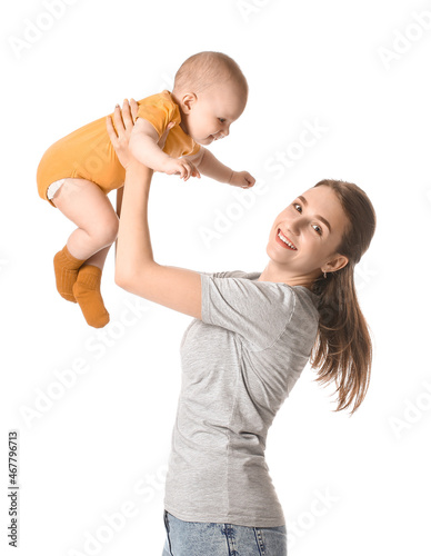 Young mother holding little...