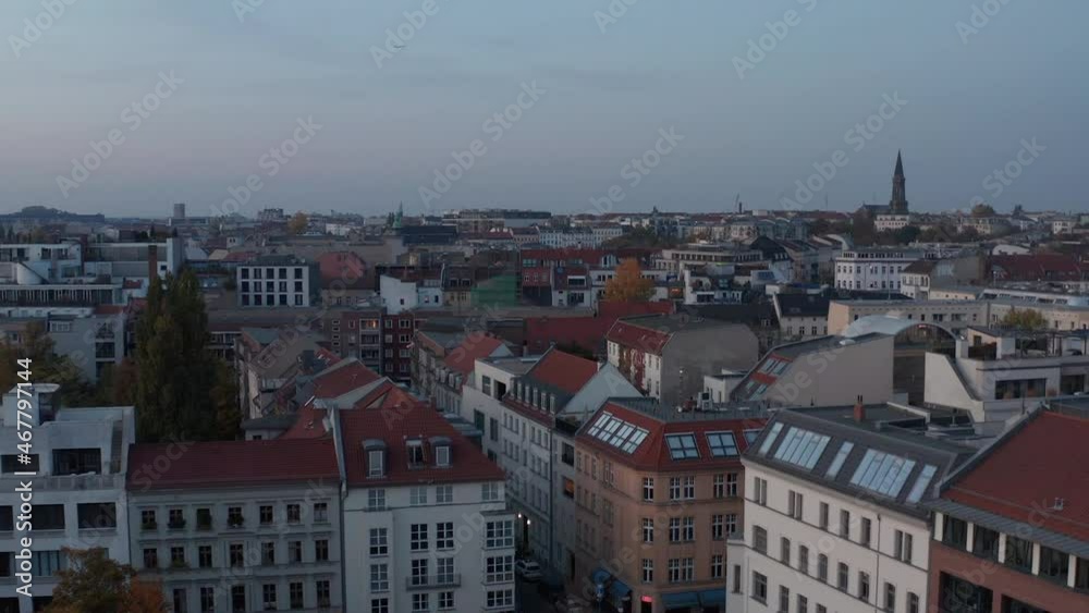 Evening forwards fly above urban district. Multistorey apartment buildings along streets. Berlin, Germany Evening forwards fly above urban district. Multistorey apartment buildings along streets. Berlin, Germany