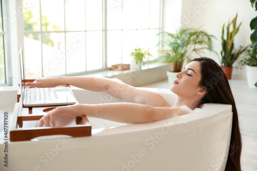 Relaxed young woman taking ...