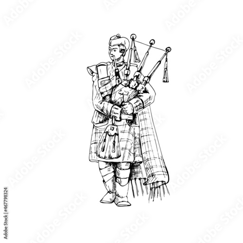 Tablou canvas Scottish man dressed in kilt playing traditional bagpipes