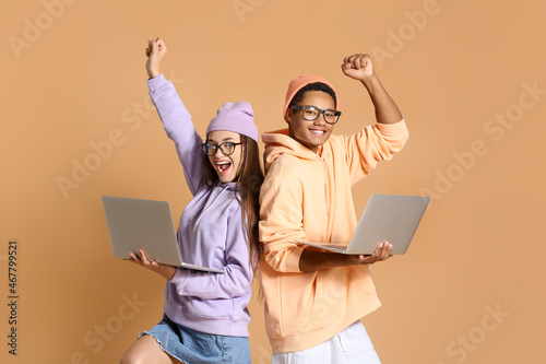 Happy young couple in hoodi...