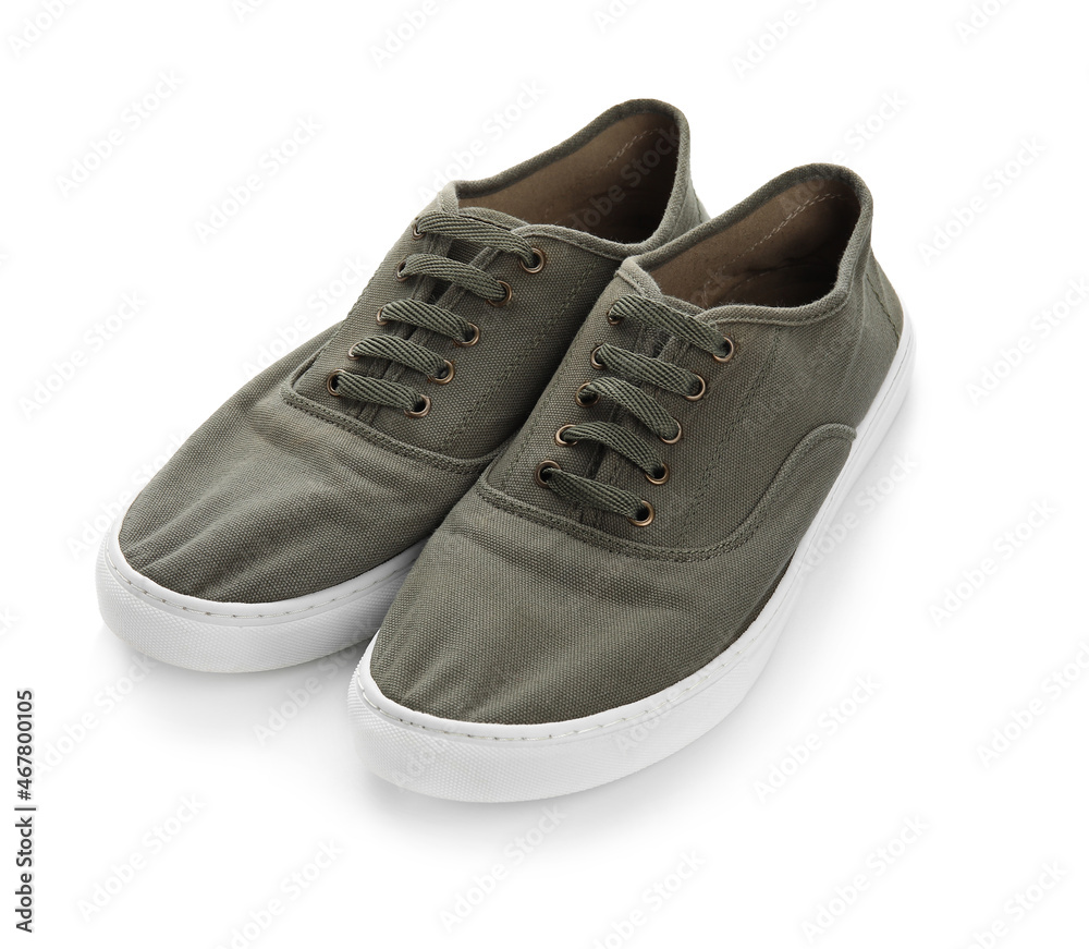 Pair of casual shoes with laces on white background