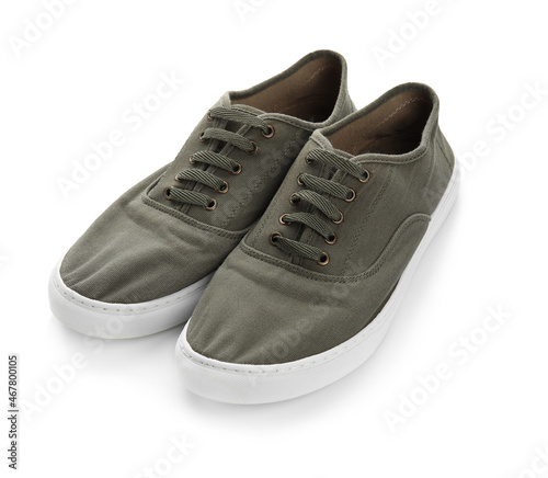 Pair of casual shoes with laces on white background