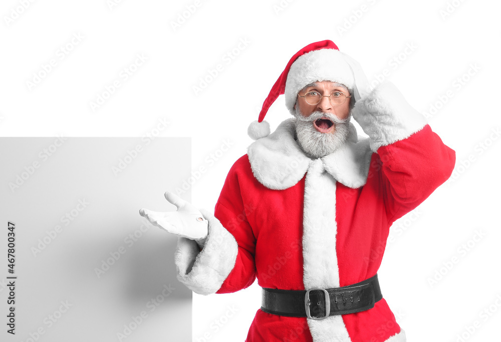 Shocked Santa Claus with blank poster on white background Shocked Santa Claus with blank poster on white background
