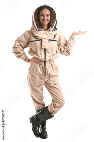 Female beekeeper showing so...