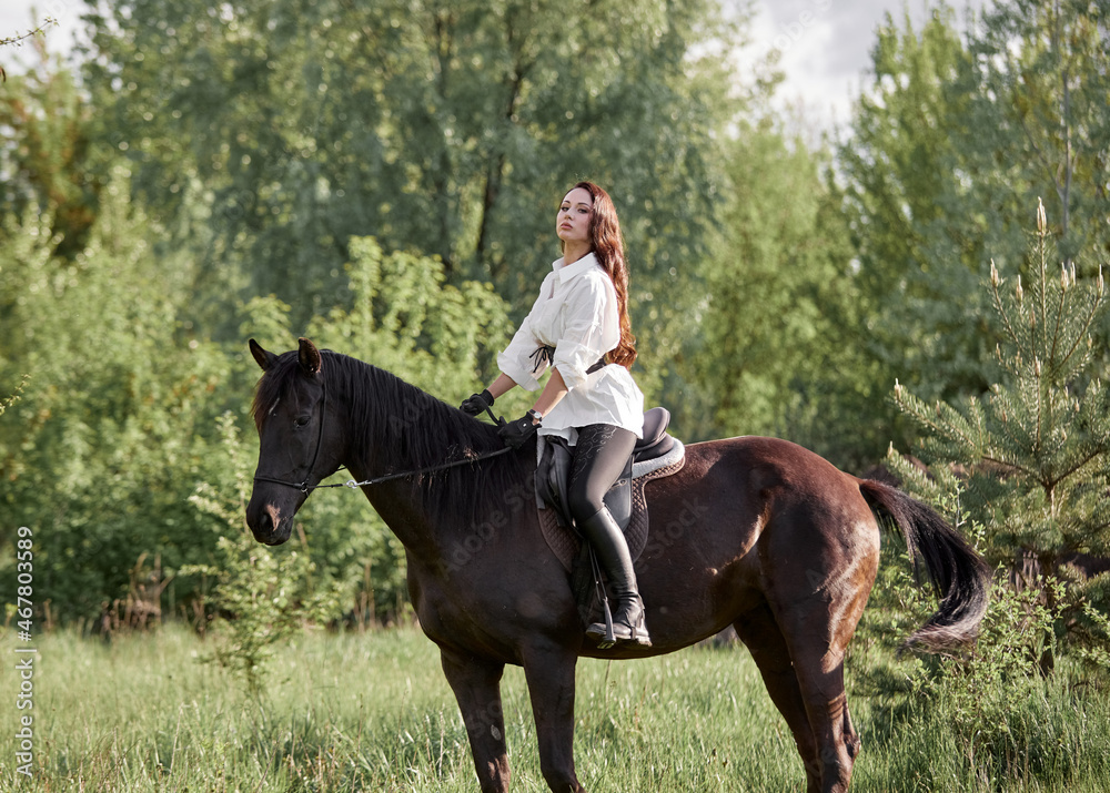 Beautiful long-haired girl riding a horse Beautiful long-haired girl riding a horse