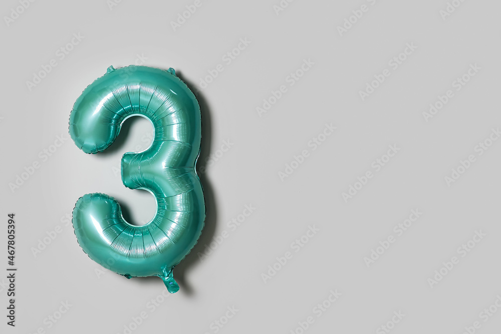 Color balloon in shape of figure 3 on light background Color balloon in shape of figure 3 on light background