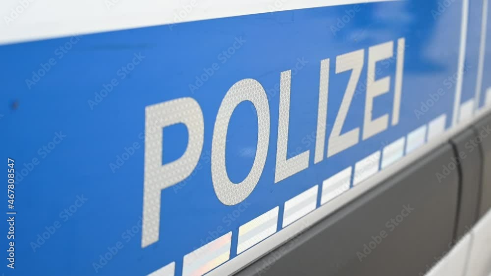 German police car on the street. Side view of a police car with the lettering 