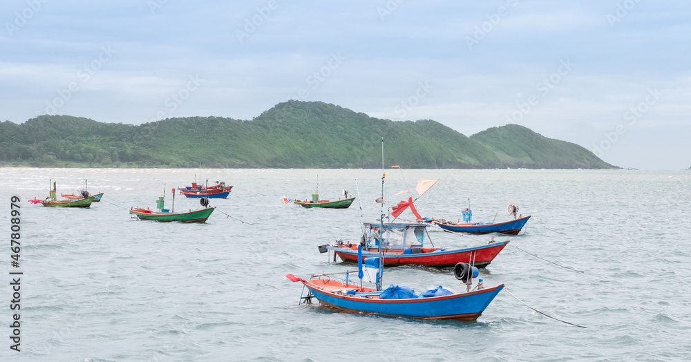 Many fishing boats are catching fish for sell at the seafood market, View of fishing boats at The fishing port.