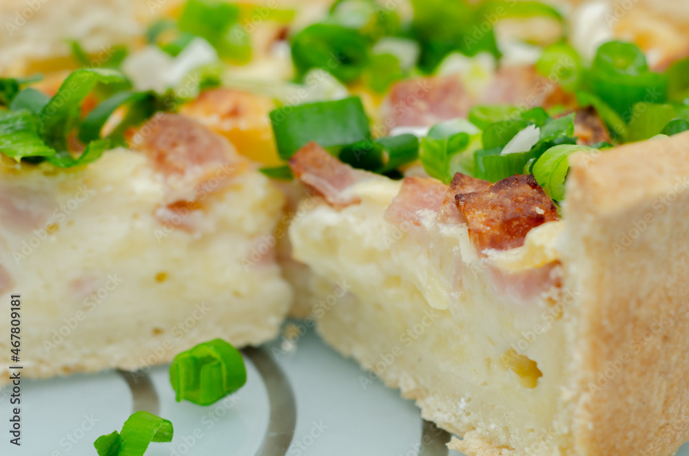 Quiche Lorraine, smoked bacon with medium and mature cheddar cheese and egg quiche filling in a shortcrust pastry Quiche Lorraine, smoked bacon with medium and mature cheddar cheese and egg quiche filling in a shortcrust pastry