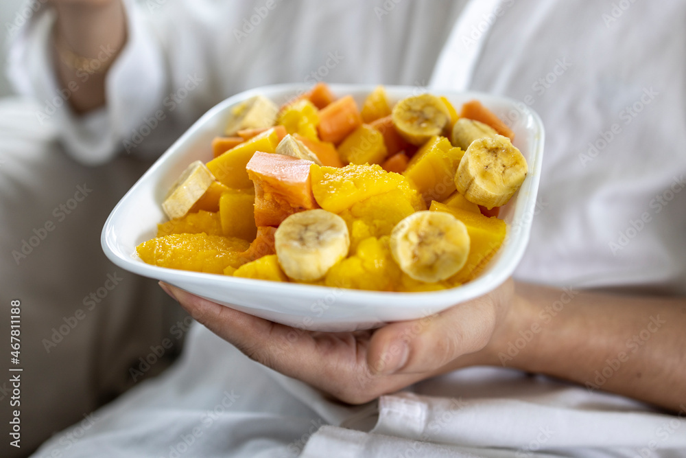 Closeup of person holding bowl of fresh fruit Closeup of person holding bowl of fresh fruit
