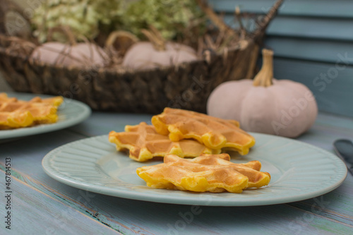 Viennese pumpkin waffles on an old wooden table.
