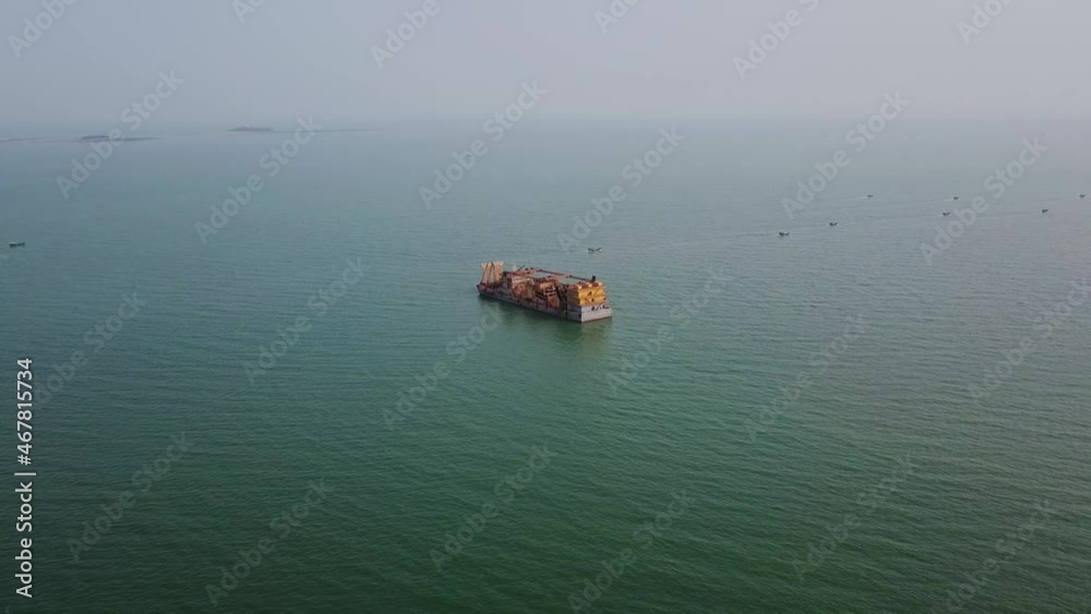 Aerial close-up of a gravel salvage ship near the sea, sand mining ship Aerial close-up of a gravel salvage ship near the sea, sand mining ship