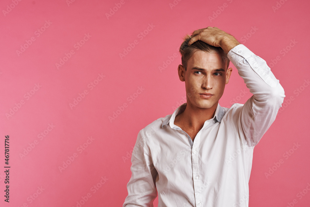 handsome man posing white shirt fashion self confidence pink background handsome man posing white shirt fashion self confidence pink background