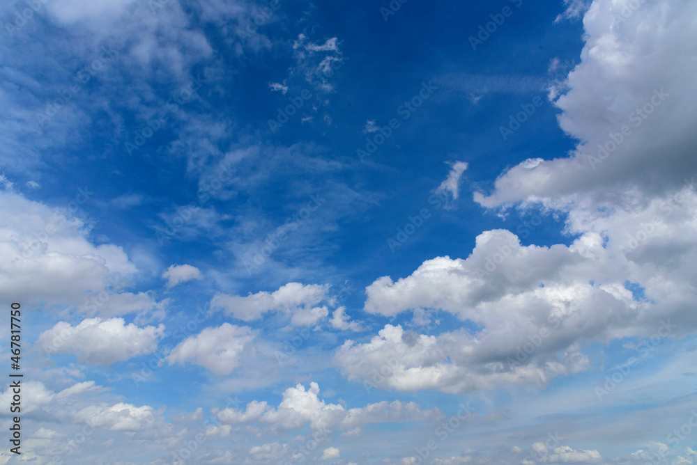 Blue sky fluffy white clouds on summer season bright clear skyline with beautiful cloudscape. Panorama blue sky clouds pattern on daylight with copy space. Cumulus cloudscape air climate sunny day Blue sky fluffy white clouds on summer season bright clear skyline with beautiful cloudscape. Panorama blue sky clouds pattern on daylight with copy space. Cumulus cloudscape air climate sunny day