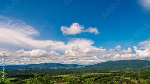 Beautiful landscape mountain green field grass meadow white cloud blue sky on sunny day. Majestic green scenery big mountain hill cloudscape valley panorama view in countryside greenery pasture