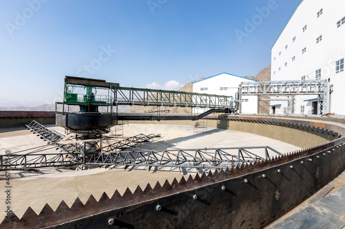 Concrete thickiner for mining plant. The discharge rate of underflow slurry is manipulated to maintain a steady solids inventory in the thickener. photo