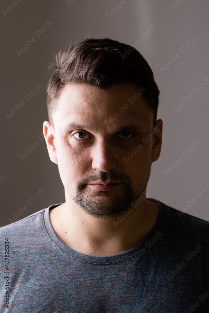 isolated photo: portrait of handsome man. shadow on face