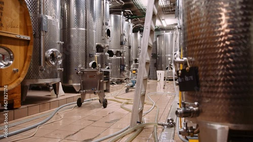 Massive stainless steel wine fermentation tanks in modern wine-cellar