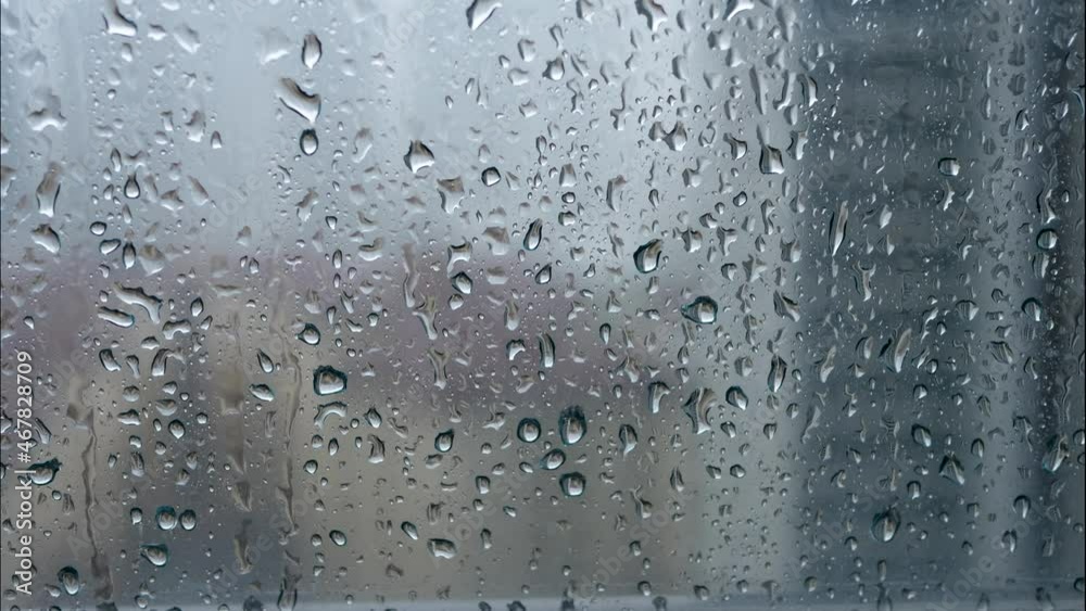 Glass window at rain day on city view background. Sad and loneliness. Time lapse