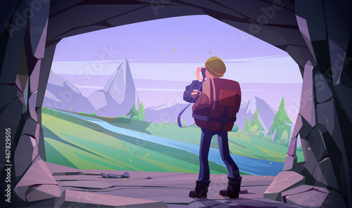 Hiker man taking photo of mountain landscape in cave entrance. Vector cartoon illustration of tourist photographer with camera in stone cavern and scene with rocks, trees and river