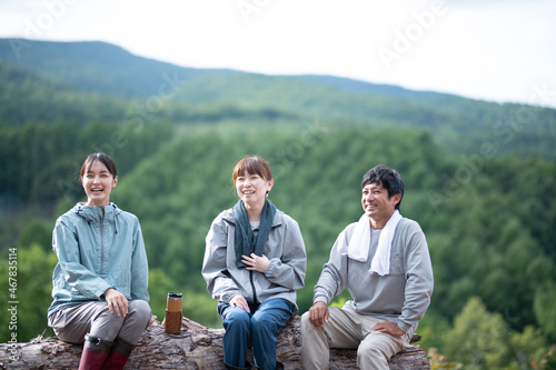 Man and Women Resting on the Top of Mountain