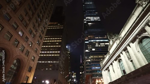 Looking up business and financial skyscraper buildings in NYC. Financial district of New York City at night. City in America. 