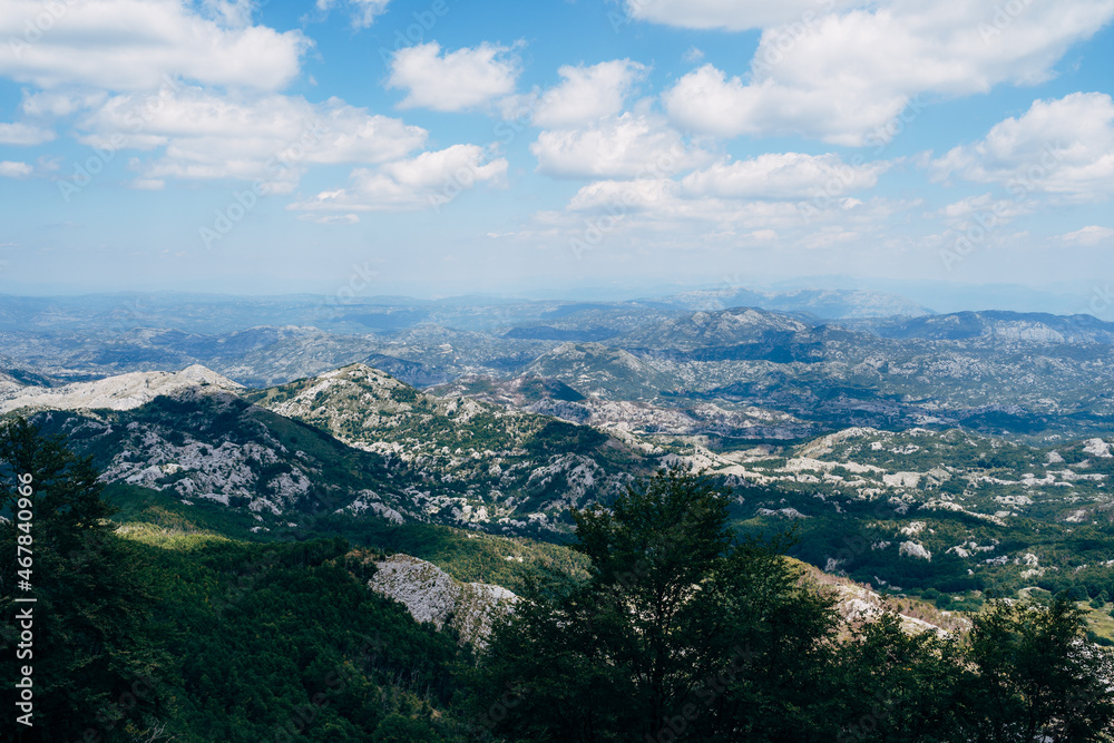 Forested mountain range under sunlight. Montenegro