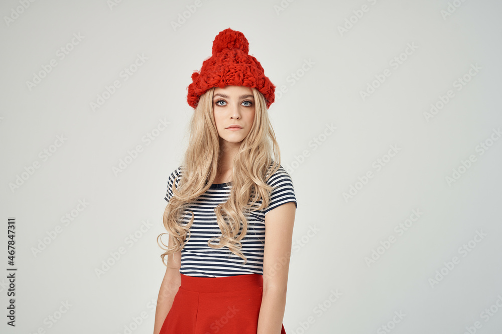 beautiful woman in fashionable clothes Red Hat light background beautiful woman in fashionable clothes Red Hat light background