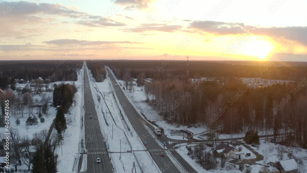 Pull back shoot above a highway. Golden hour, low traffic winter evening. Pull back shoot above a highway. Golden hour, low traffic winter evening.