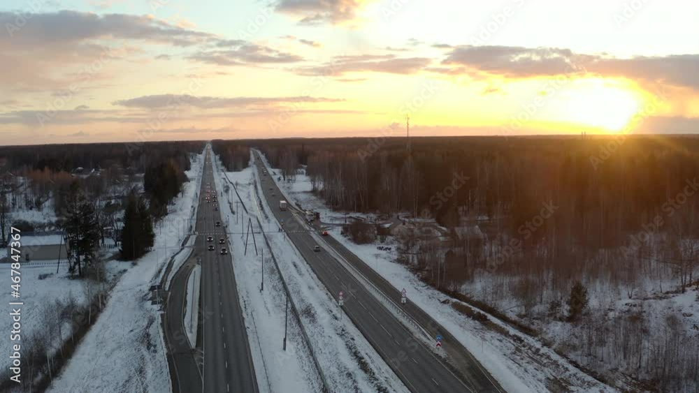 Drone flight in golden hours above expressway in Northern Europe. Golden hour, low traffic and peaceful atmosphare, Drone flight in golden hours above expressway in Northern Europe. Golden hour, low traffic and peaceful atmosphare,