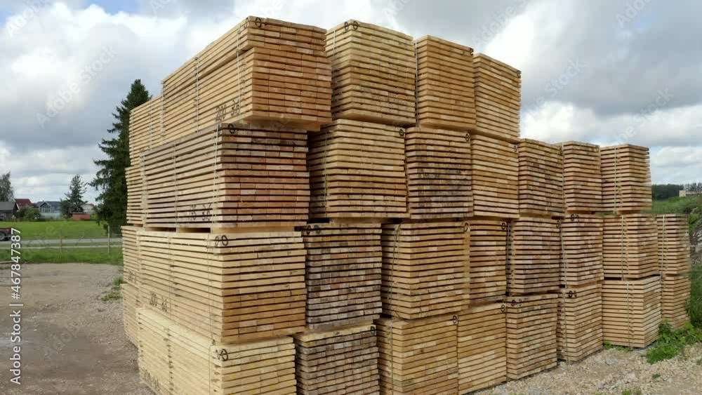 Crane style shoot of lumber - stacked wood materials prepared for export. Stacks of wood planks. Crane style shoot of lumber - stacked wood materials prepared for export. Stacks of wood planks.
