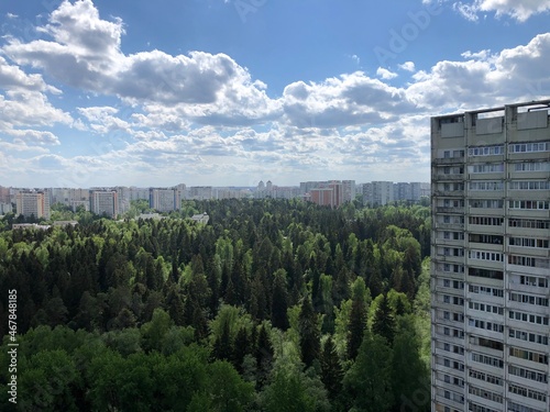 a view down on the forest and the city. summer, moscow region
