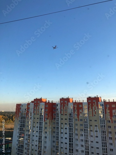 Panoramic Background with flying plane in blue sky