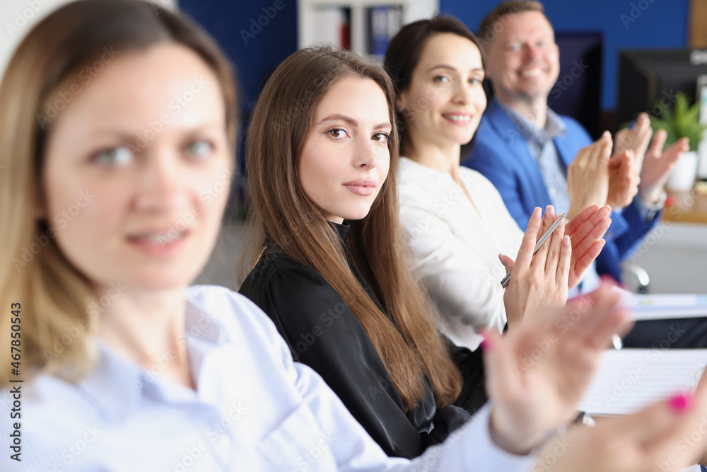 Workers in presentable suits sit in room Workers in presentable suits sit in room