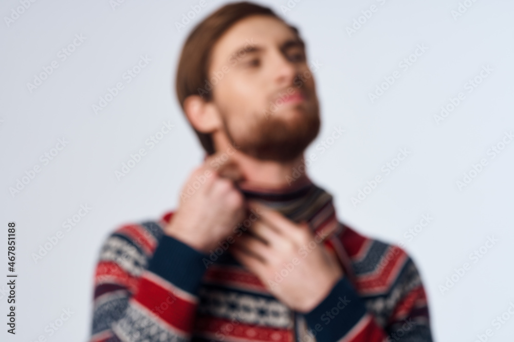 Fototapeta premium sick man in a scarf clings to the neck infection virus light background