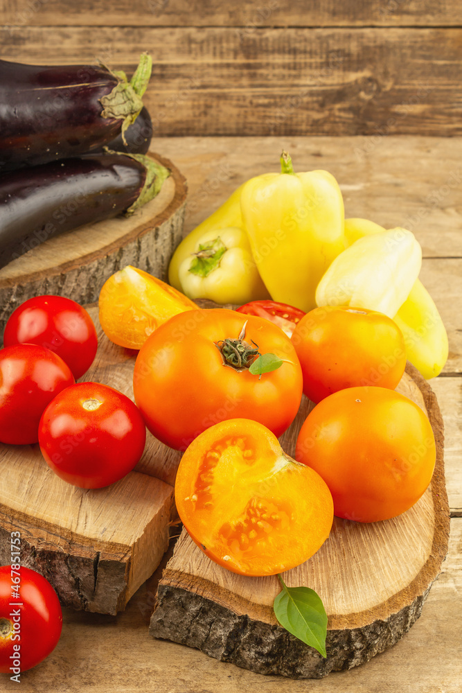 Assortment of fresh vegetables on a wooden background