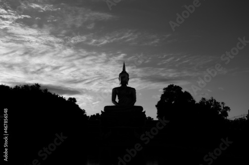 city cathedral silhouette shadow of standing buddha and thai temple with sky