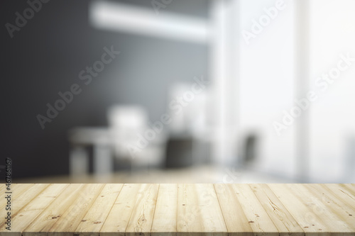 Empty office wooden desktop with empty space on modern workplace with laptop background, closeup, mock up © Pixels Hunter