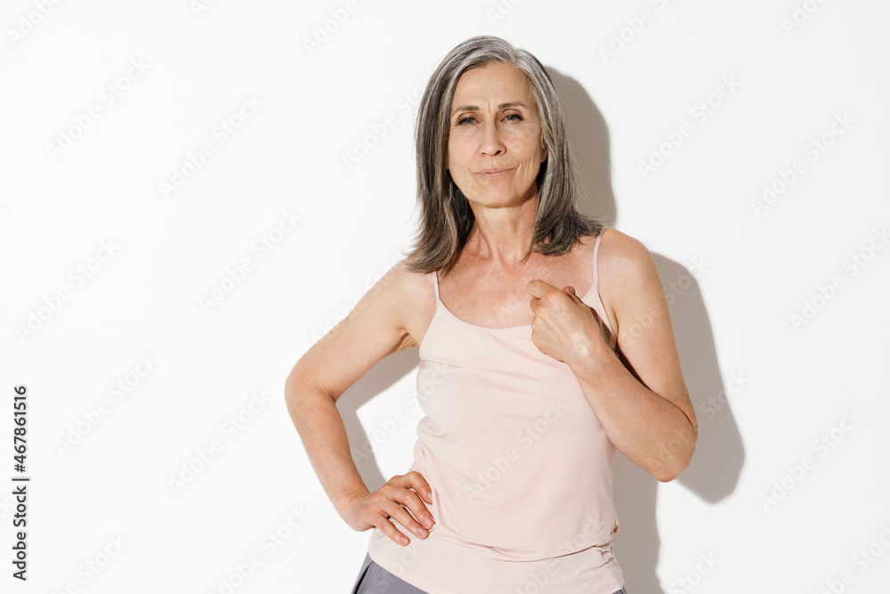 Mature grey woman posing and looking at camera Mature grey woman posing and looking at camera