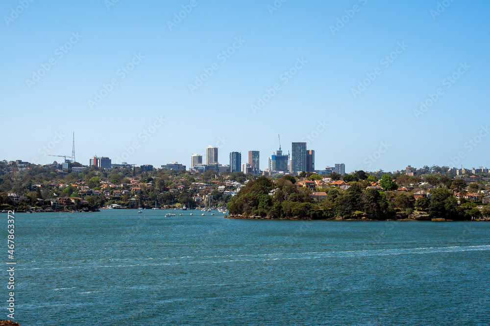 Suburban city skyline with harbour coastal bushland in the foreground, Sydney, NSW, Australia