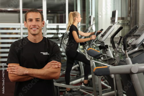 Portrait of personal trainer in modern gym